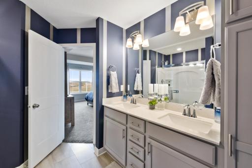(Photo is of a decorated model, actual homes finishes will vary) Convenient, private & relaxing! Time for some piece & quiet as you have your own getaway in your owner's suite & private bath!