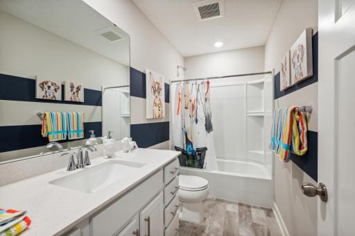 (Photo is of a decorated model, actual homes finishes will vary) There is a upper level full hallway bathroom that is conveniently located by the bedrooms & laundry space.