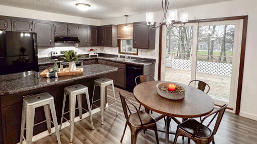 1707 Oak Knoll Dr. NE, Alexandria, MN 56308-spacious dining / kitchen are opens to the huge deck overlooking the massive yard.