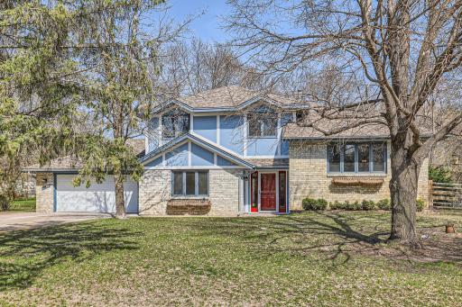 Welcome to this executive 4-level split home on nearly an acre!