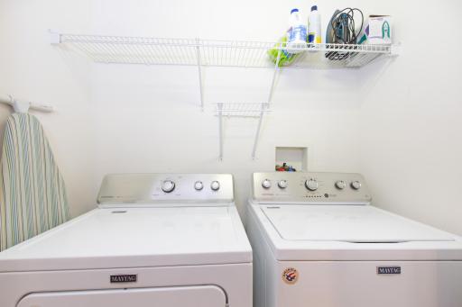 Laundry conveniently located on upper level near bedrooms. Storage shelf for laundry supplies.