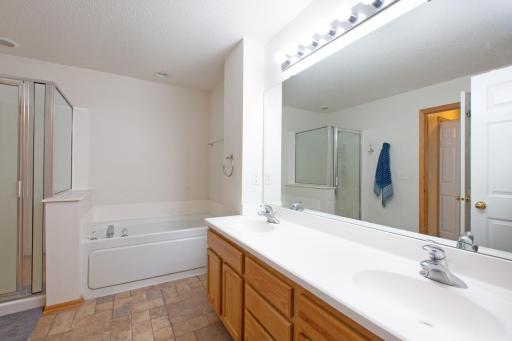 Upper level bath with double sinks and large mirror.