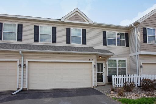 Welcome to 873 Braunworth Court in Chaska. This two-level townhome provides two bedrooms with a loft, two-car garage and an inviting front patio!