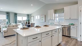 Large breakfast bar on the kitchen island. Photo of Model Home. Options and colors may vary. Ask Sales Agent for details.