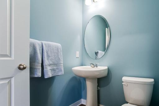 The Finnegan's main level also holds a half bath perfect for guest use without stairs! Photos of model home. Colors and options may vary. Ask Sales Agent for details.