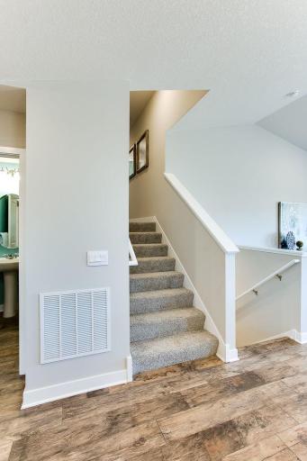 This smart layout is just seven steps up or down to the additional living areas. Photos of model home. Colors and options may vary. Ask Sales Agent for details.