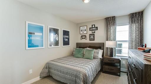 Each of the home's spacious secondary bedrooms feature well thought out window locations. Photo is of model home. Colors and options may vary. Ask Sales Agent for details.
