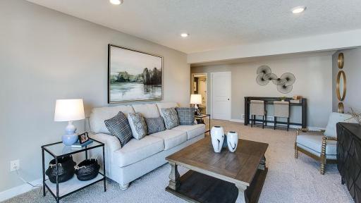 Huge lower level family room. Photo of Model Home. Options and colors may vary. Ask Sales Agent for details.