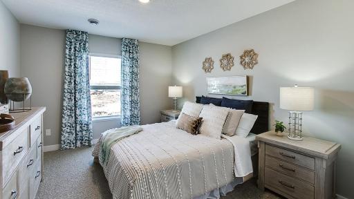 Lower level bedroom. Photos of model home. Colors and options may vary. Ask Sales Agent for details.