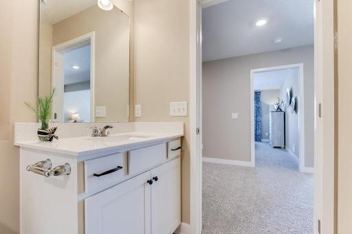 Another full bathroom on the lower level. Photos of model home. Colors and options may vary. Ask Sales Agent for details.