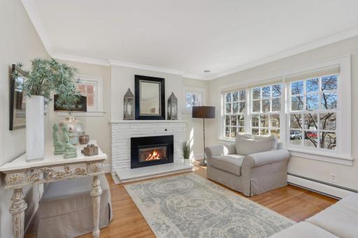 Gorgeous living room with refinished hardwood floors, beautiful gas fireplace and stunning window views!