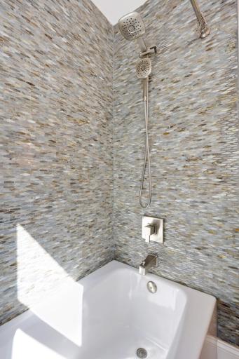 Wow! Take a look at this stunning bathroom tile and relaxing soaking tub!