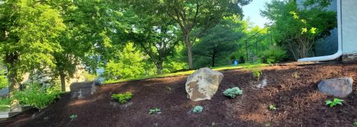 Hand-picked stones have been strategically positioned to accent the artistic landscaping.