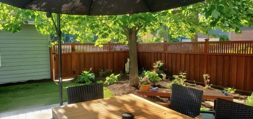 Summer under the shaded deck.....ahhhh. The irrigation system makes for very minimal maintenance!