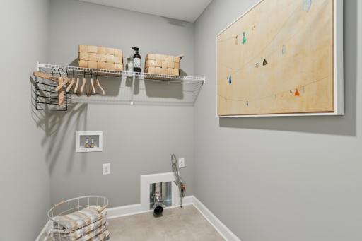 Photo of similar home, colors and finishes will vary. The Magnolia twin home offers the convenience of one-level living, including having the laundry room nearby without any stairs needed for access.