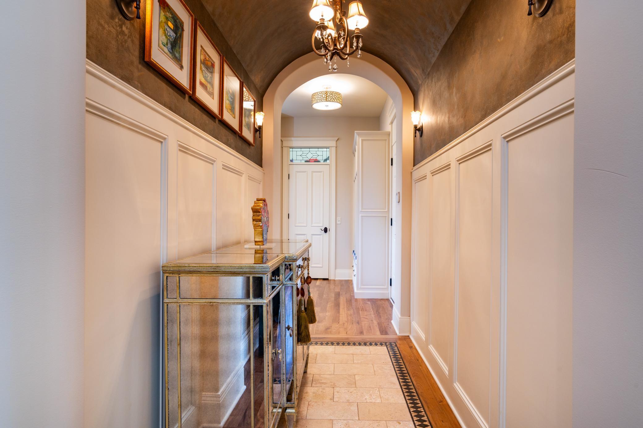 Barrel Vault and Inlay Travertine Floor in Main Floor Hallway