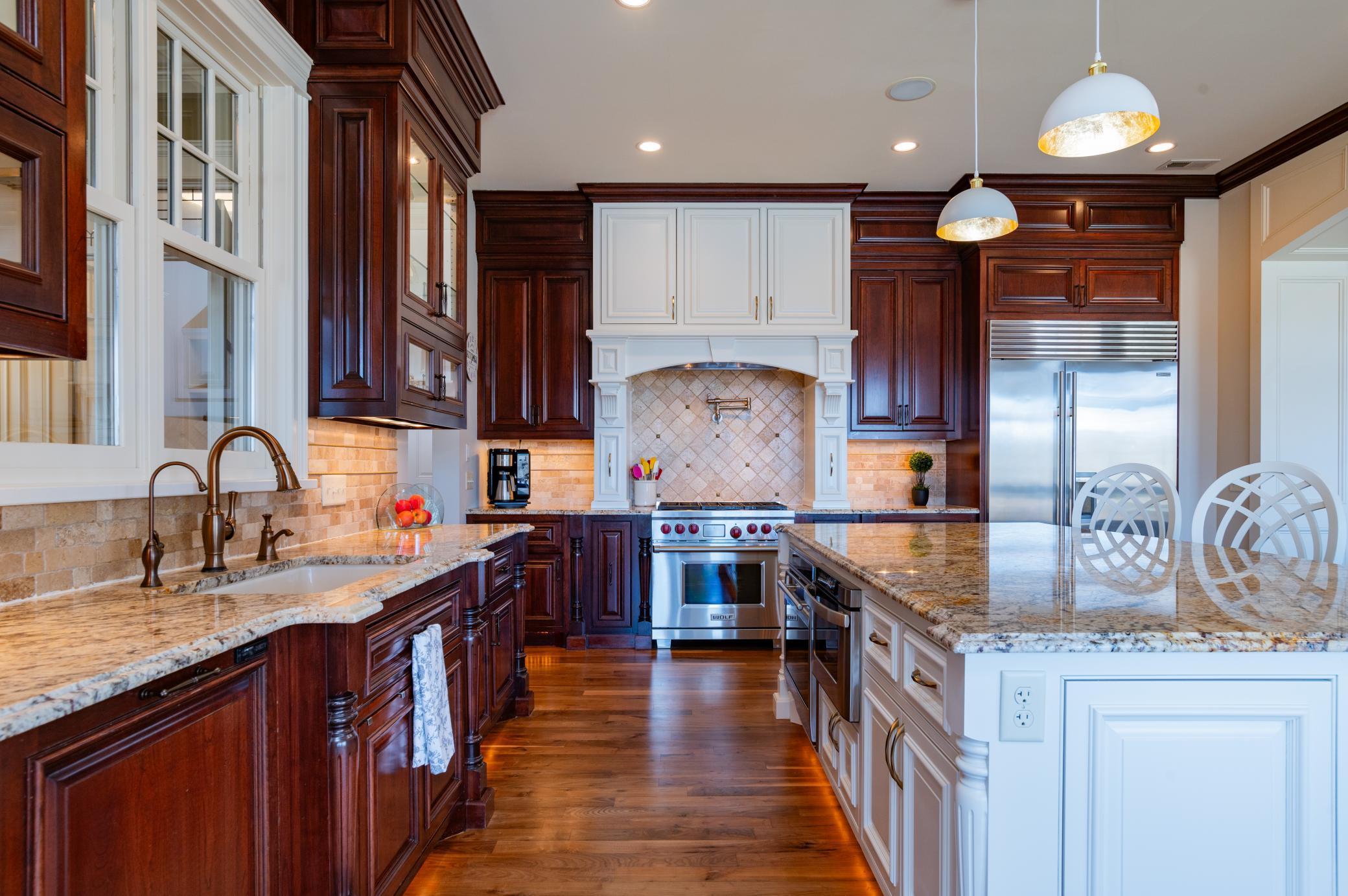 Spacious gourmet kitchen with High-end Stainless Appliances, Stone Countertops & Updated Lighting