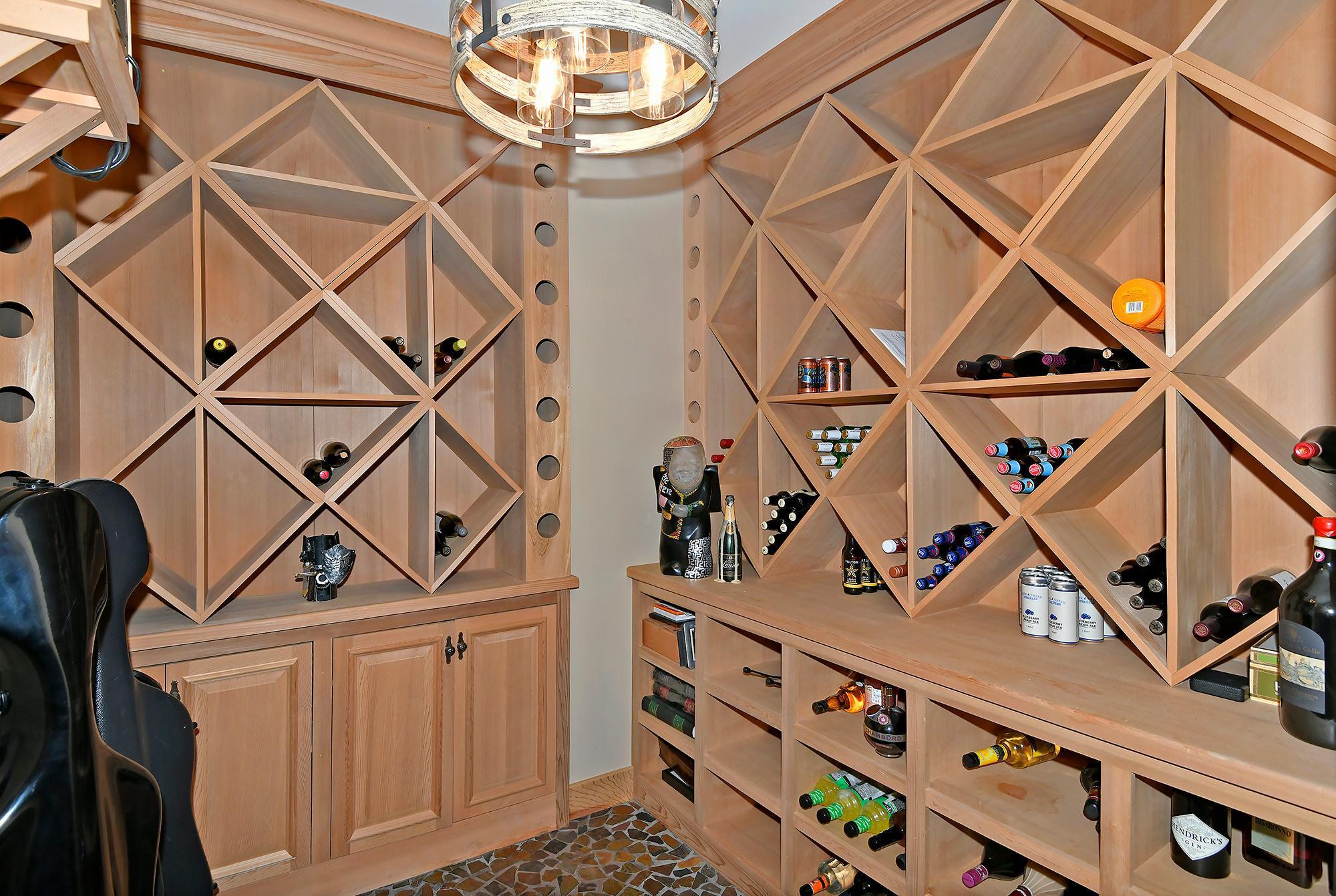 Wine Cellar with Cooler, Stone Mosaic Floor and Custom Lighting
