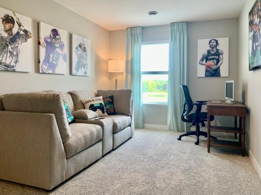 With four bedrooms upstairs, we envision one being used as an office, game room, or den. (Model photo, colors may vary)