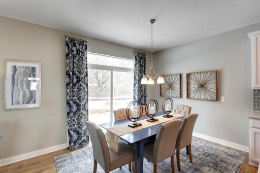 Situated next to the patio door for easy access to backyard entertainment, the dinette provides plenty of space for nearly any size table. *photo of model with same floor plan. Selections will differ.