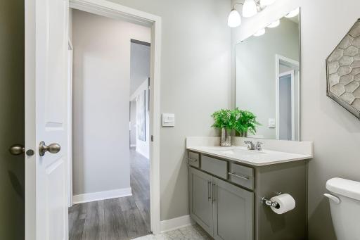 Main level 3/4 bath. Model photo. Options and colors will vary.