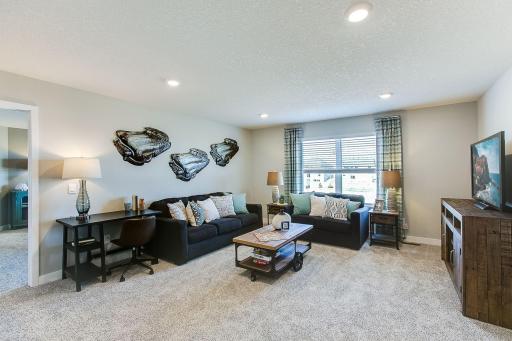 Relax, play and enjoy! This upper level game room provides an additional 270 square feet of living space and is conveniently located adjacent to all four of the upper level bedrooms. *Photo of previous model. Selections may vary.