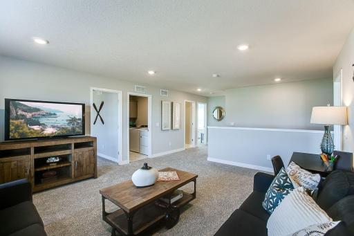Relax, play and enjoy! This upper level game room provides an additional 270 square feet of living space and is conveniently located adjacent to all four of the upper level bedrooms. *Photo of previous model. Selections may vary.