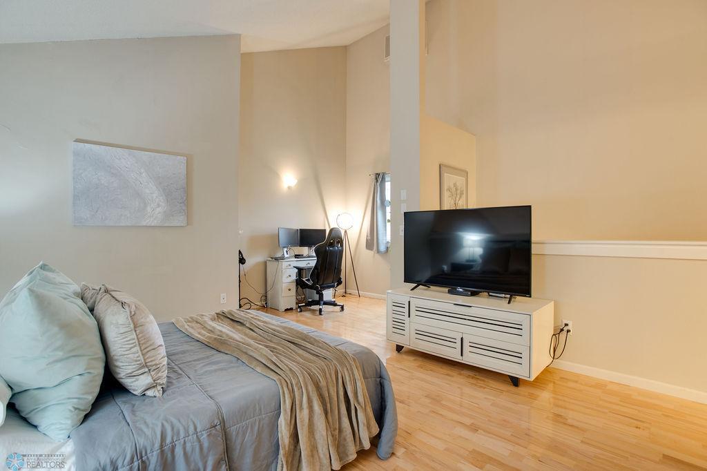 loft bedroom with additional work/seating area