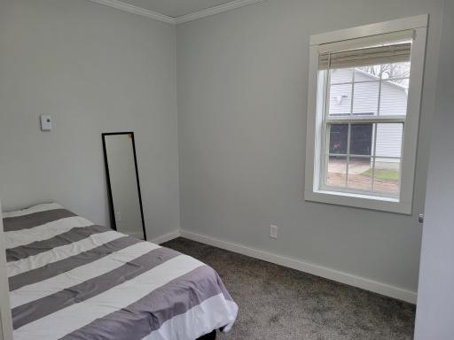 Main level bedroom with large windows to let in natural light!