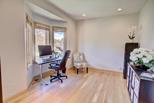 Work from home office setting with ample privacy, ample natural light and views of the front yard.