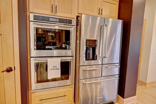 A double oven featuring high end stainless steel appliance package.
