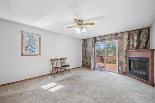 Family room features a gas fireplace and walks out to the back yard deck.
