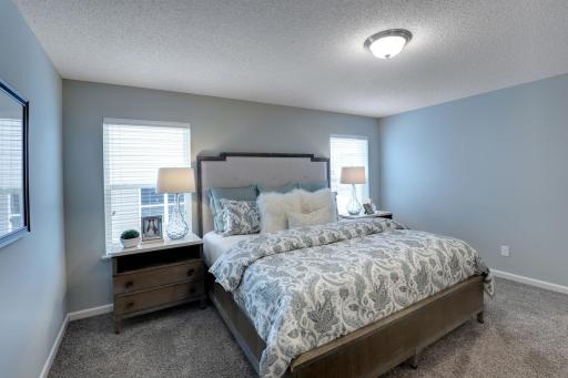 Another view of the primary bedroom in the Cameron II model with bathroom en-suite. Photos of model home. Colors and options may vary. Ask Sales Agent for details.