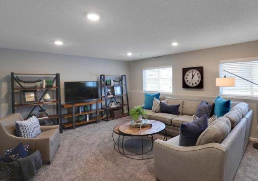 Huge lower level family room. Photo of Model Home. Options and colors may vary. Ask Sales Agent for details.