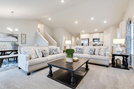 Cozy and comfortable living room, with ample space and natural light. Lots of space to relax. Photo of Model Home. Options and colors may vary. Ask Sales Agent for details.