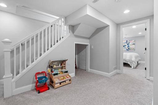 Cute Playroom Nook Under Stairs and Looking into Basement 5th Bedroom