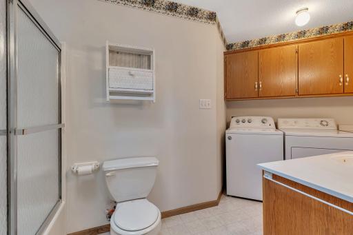 Primary on suite with laundry + a large skylight above shower