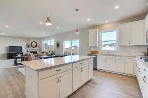 Signature kitchen with white cabinets. Stunning open layout. *PICTURES OF PREVIOUS MODEL HOME, SELECTIONS AND FINISHES TO VARY.
