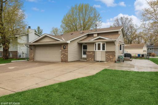 Welcome to 7800 120th Ave N, Champlin! Don't miss the large HEATED garage!