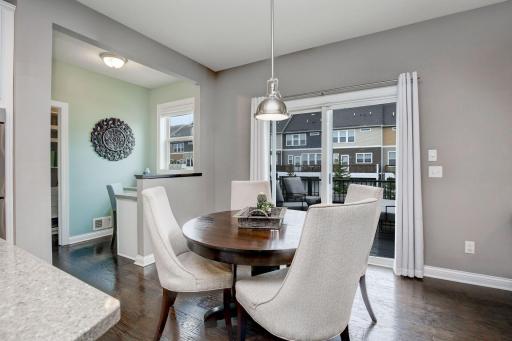 Informal dining room provides easy access to the large deck- making entertaining a snap.