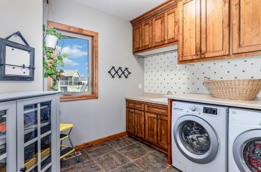 Separate laundry room between garage & kitchen.