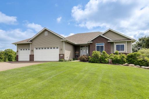 Surrounded by a manicured yard and beautiful landscaping!