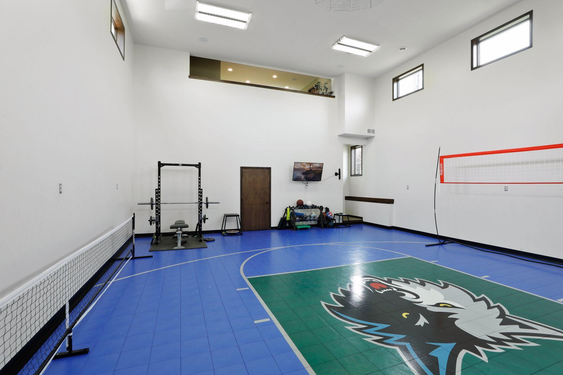 Multi-functional and versatile space setup for many hours of fun doing a variety of sports and great space for exercise equipment. You may never need to leave home!!