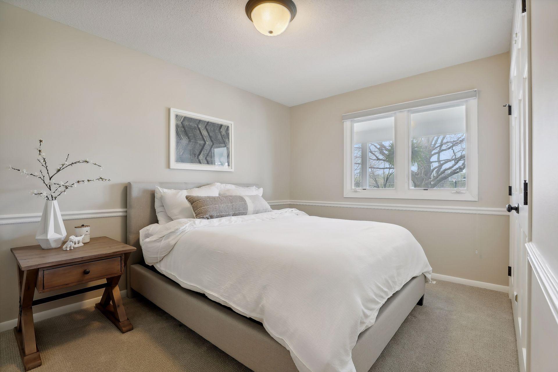 Spacious main level bedroom #2. Large closet and white, 6 panel doors.