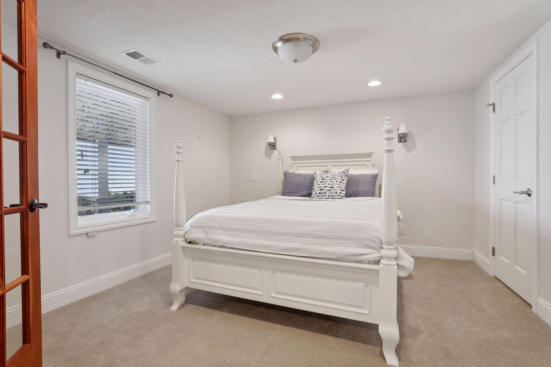 Spacious 4th bedroom in the LL offers a walk-in closet and fabulous built-in with mirror.