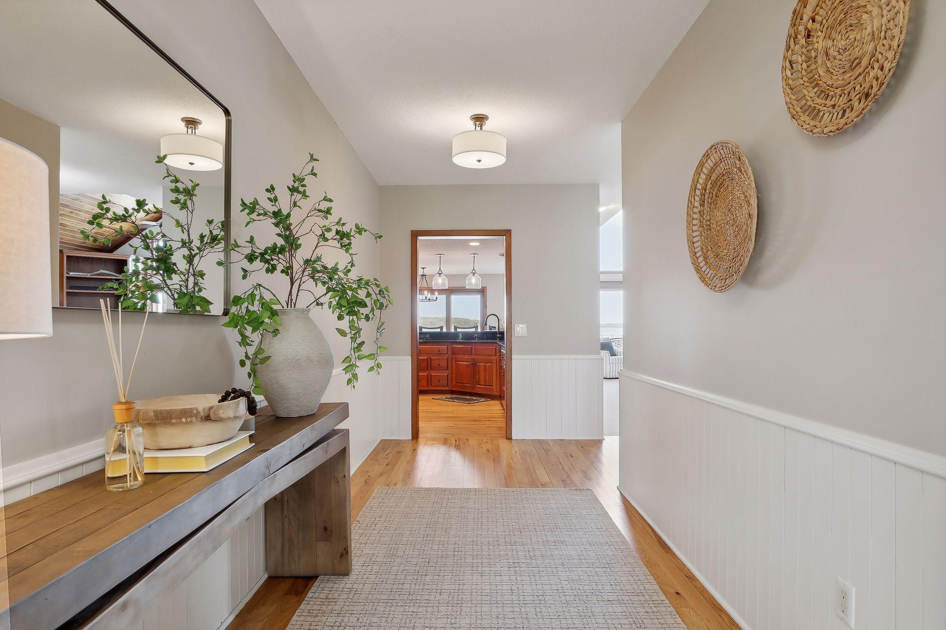 This fabulous, spacious foyer welcomes you and your guests with its beautiful hardwood flooring, neutral paint colors.