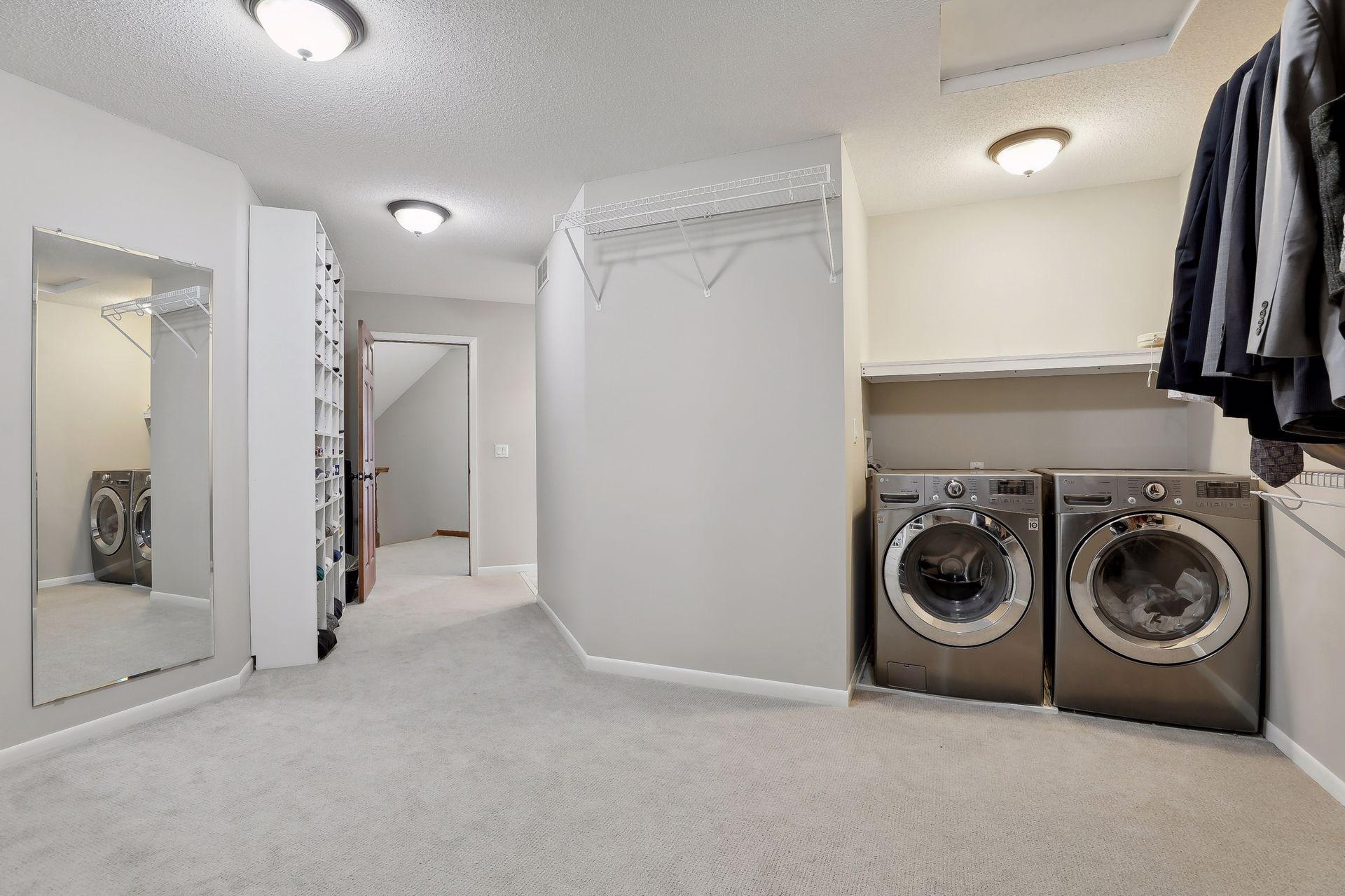 Brilliant! A 2nd laundry space perfectly set in the primary closet space!