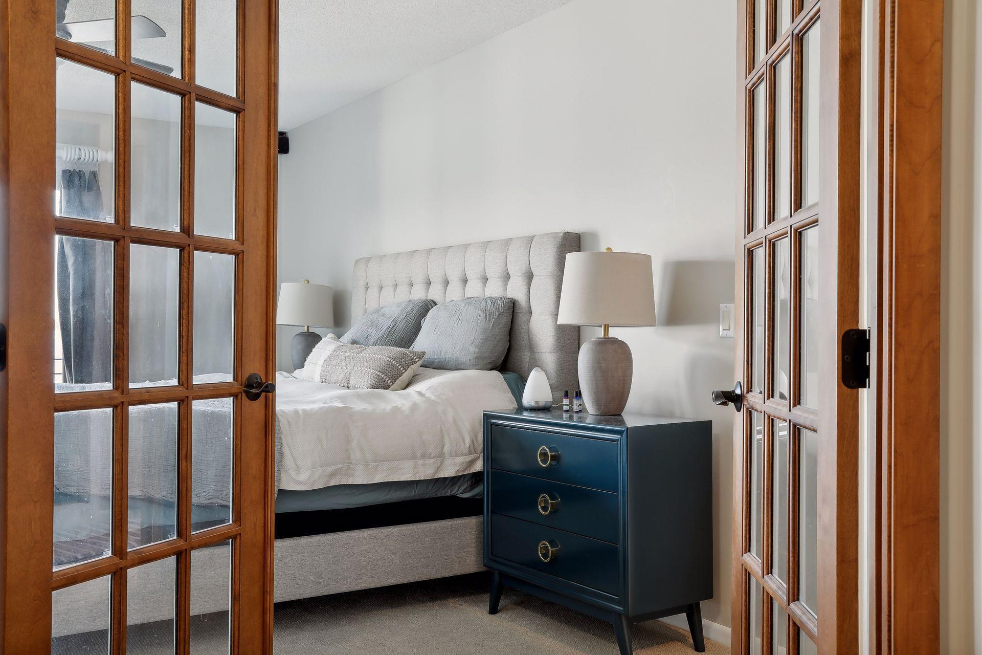 Your private, owners' suite awaits! Your welcomed by lovely French Doors!