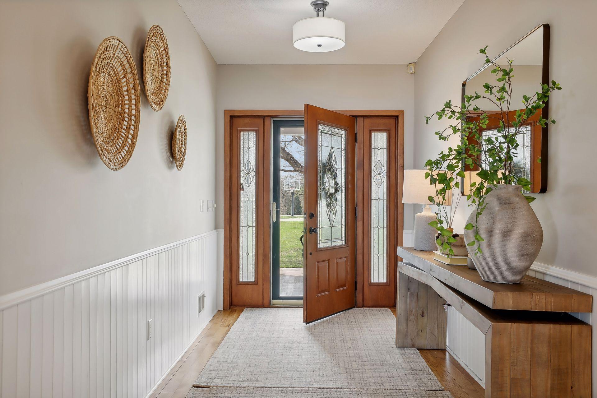 Welcome home! This fabulous, spacious foyer warmly welcomes you and your guests with its beautiful hardwood flooring, neutral paint colors.