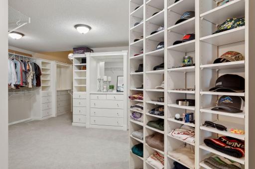 Dreamy primary closet with an abundance of built-ins, drawers, mirror and just about anything you'd imagine in the perfect closet space!!